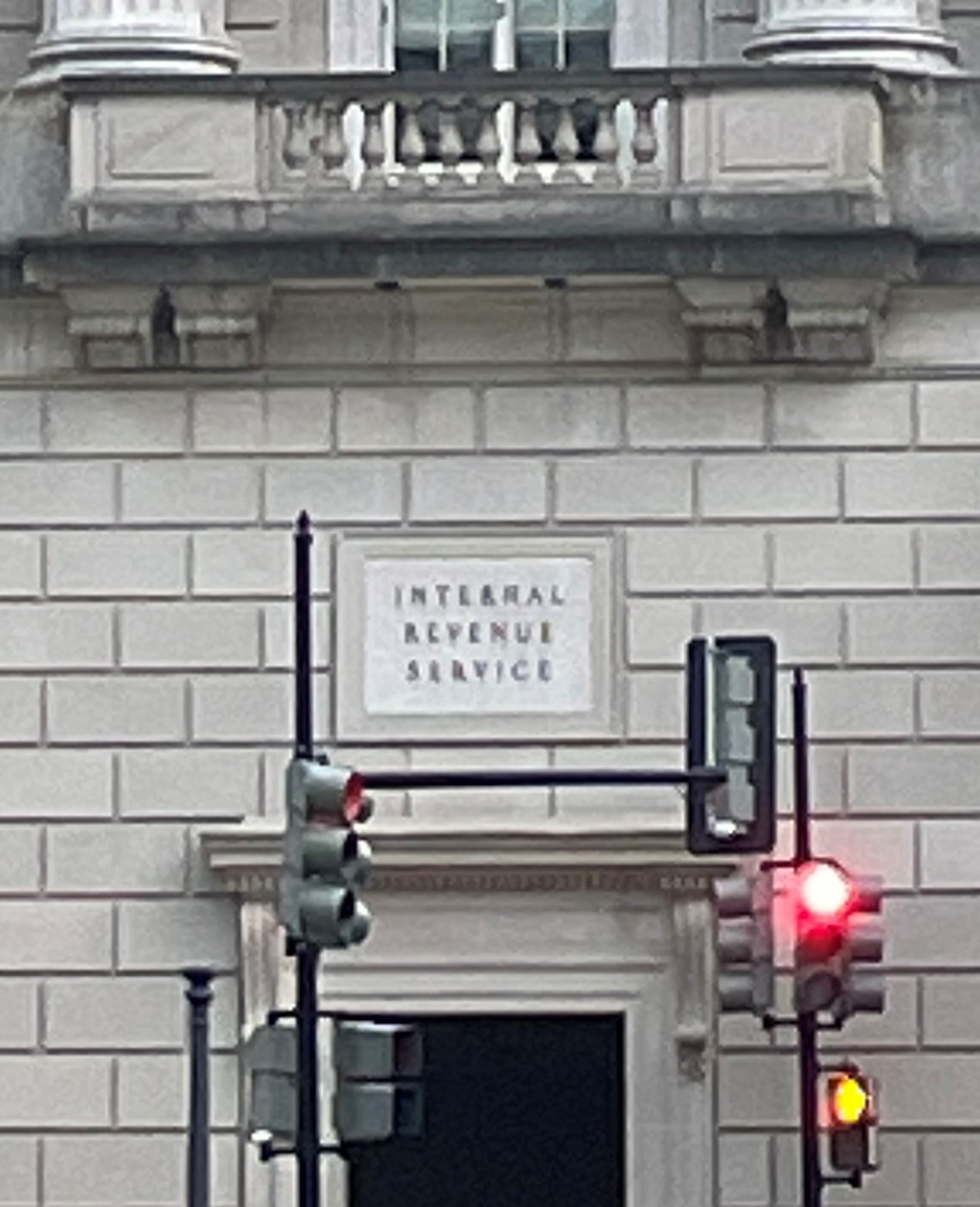 IRS Headquarters in Washington DC with a red traffic light