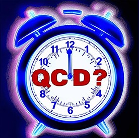 ringing alarm clock with "QCD?" on the face